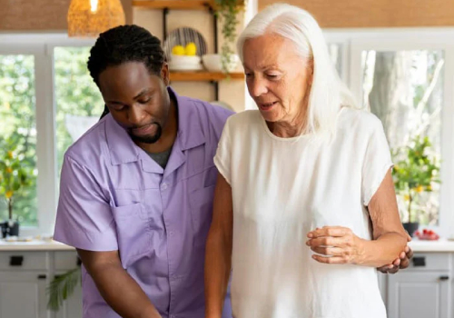 Support worker providing Assistance with Personal Care Campbellfield – helping elderly NDIS participant with mobility and daily activities in the home.